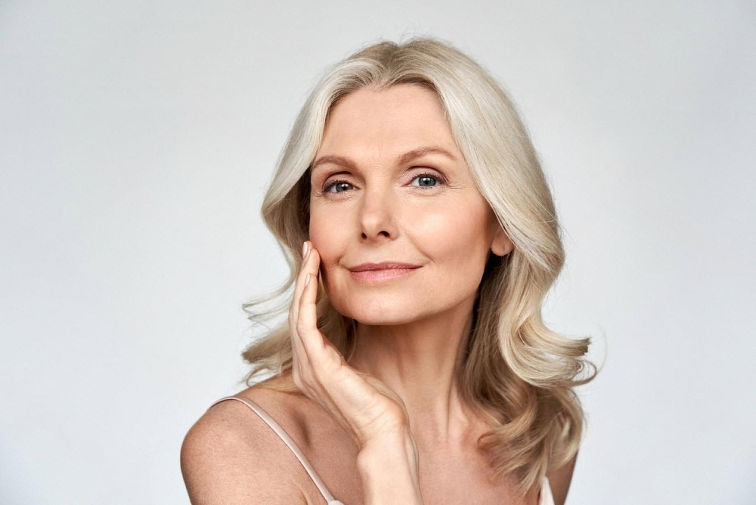 Mature woman with clear, even skin tone after melasma prevention routine